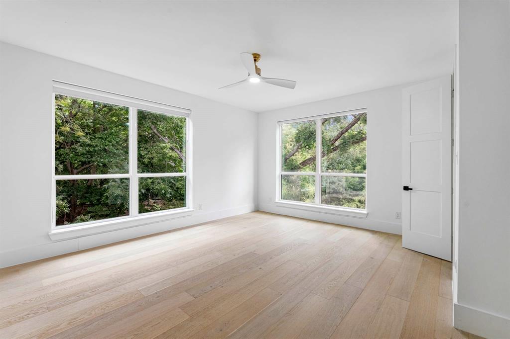 13032 Copenhill Road Dallas, TX 75240 - Photo 30 of 40 a view of an empty room with wooden floor and a window