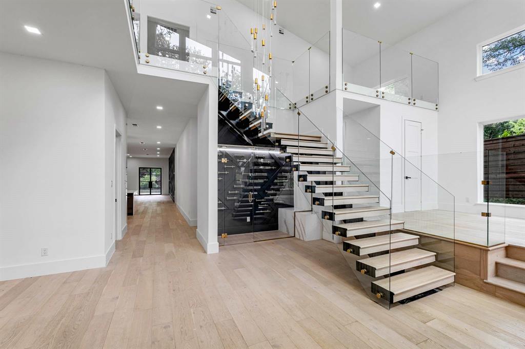 13032 Copenhill Road Dallas, TX 75240 - Photo 3 of 40 wooden floor in an empty room with a staircase
