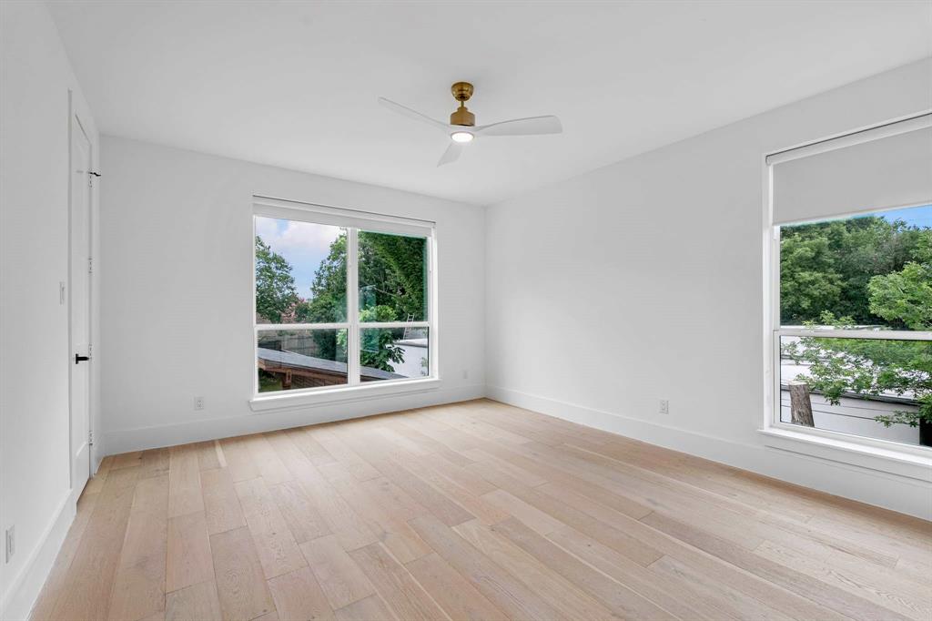 13032 Copenhill Road Dallas, TX 75240 - Photo 31 of 40 a view of an empty room with wooden floor and a window
