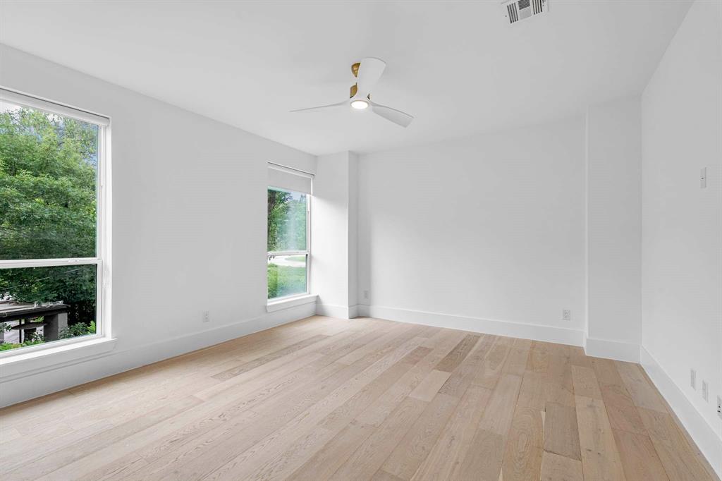 13032 Copenhill Road Dallas, TX 75240 - Photo 33 of 40 a view of an empty room with wooden floor and a window