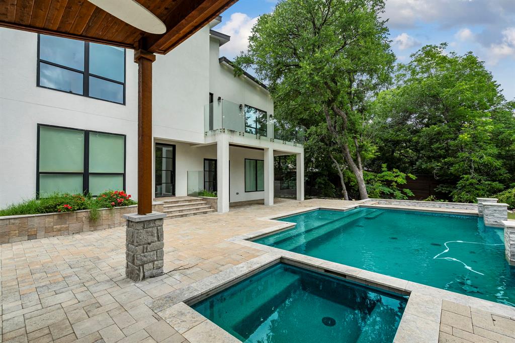 13032 Copenhill Road Dallas, TX 75240 - Photo 35 of 40 a view of a house with a yard and sitting area