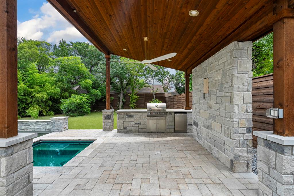 13032 Copenhill Road Dallas, TX 75240 - Photo 36 of 40 a view of a patio with a table chairs and a backyard