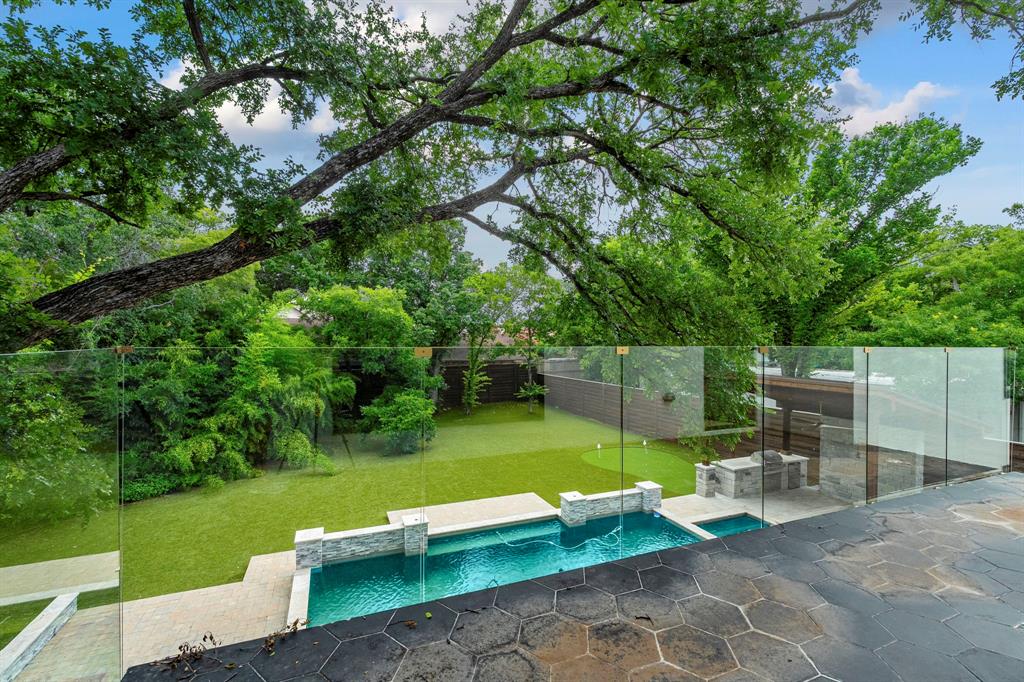 13032 Copenhill Road Dallas, TX 75240 - Photo 9 of 40 a view of a chair and table on the garden