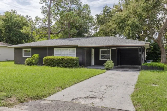 a front view of a house with a garden and porch