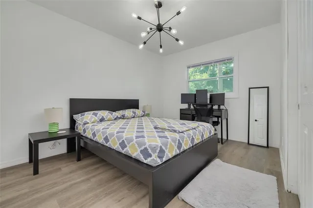 a bedroom with a bed and window