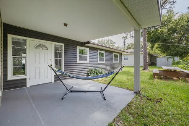a house view with a backyard space