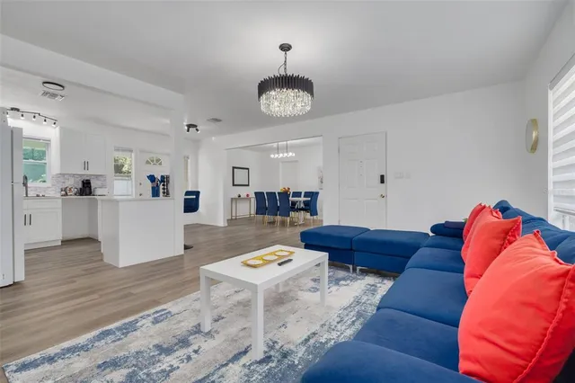 a living room with furniture and a table