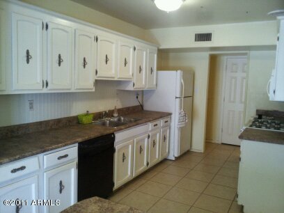 430 West Cheery Lynn Road Phoenix, AZ 85013 - Photo 4 of 12 Kitchen refrigerator side
