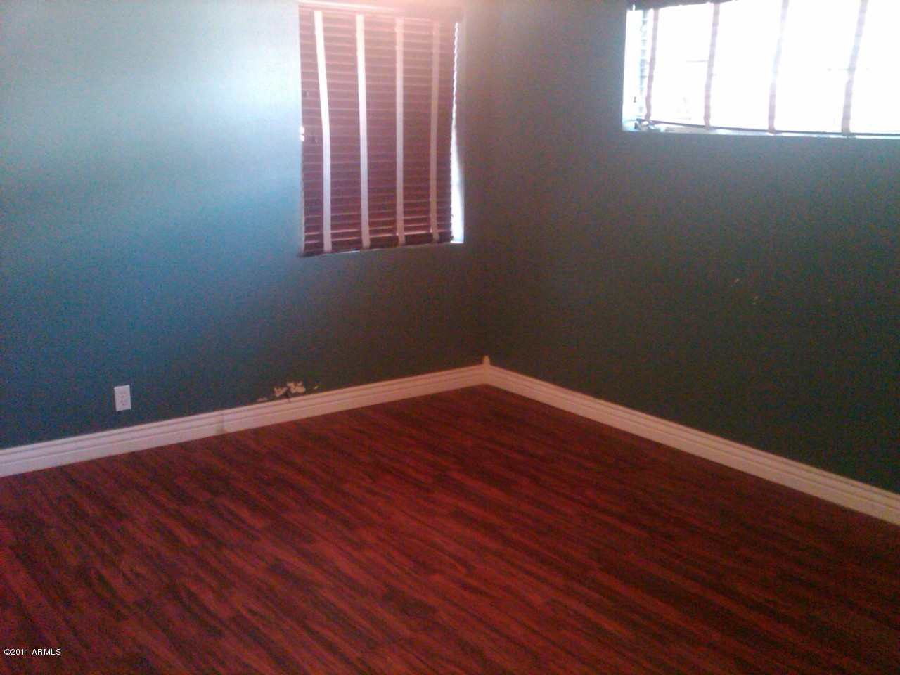 430 West Cheery Lynn Road Phoenix, AZ 85013 - Photo 8 of 12 Master bedroom has wood flooring