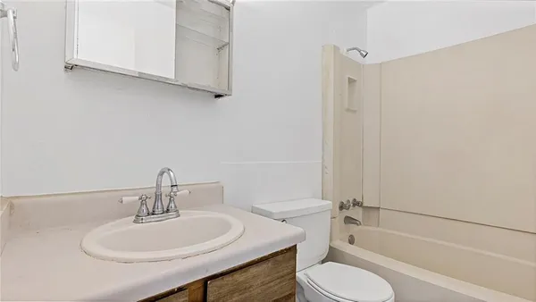 a stove top oven sitting inside of a kitchen