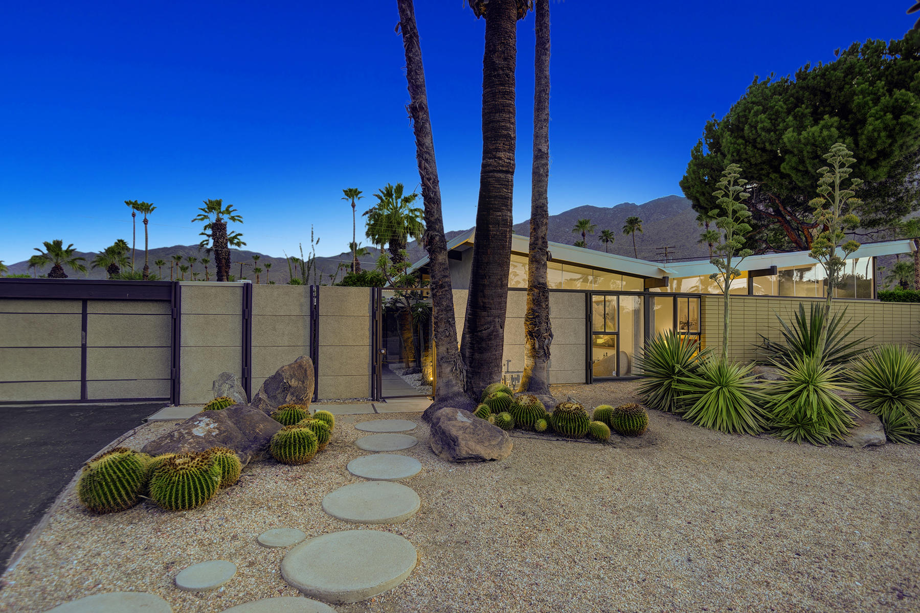 1865 Apache Circle Palm Springs, CA 92264 - Photo 2 of 42 a view of a backyard with plants and a patio