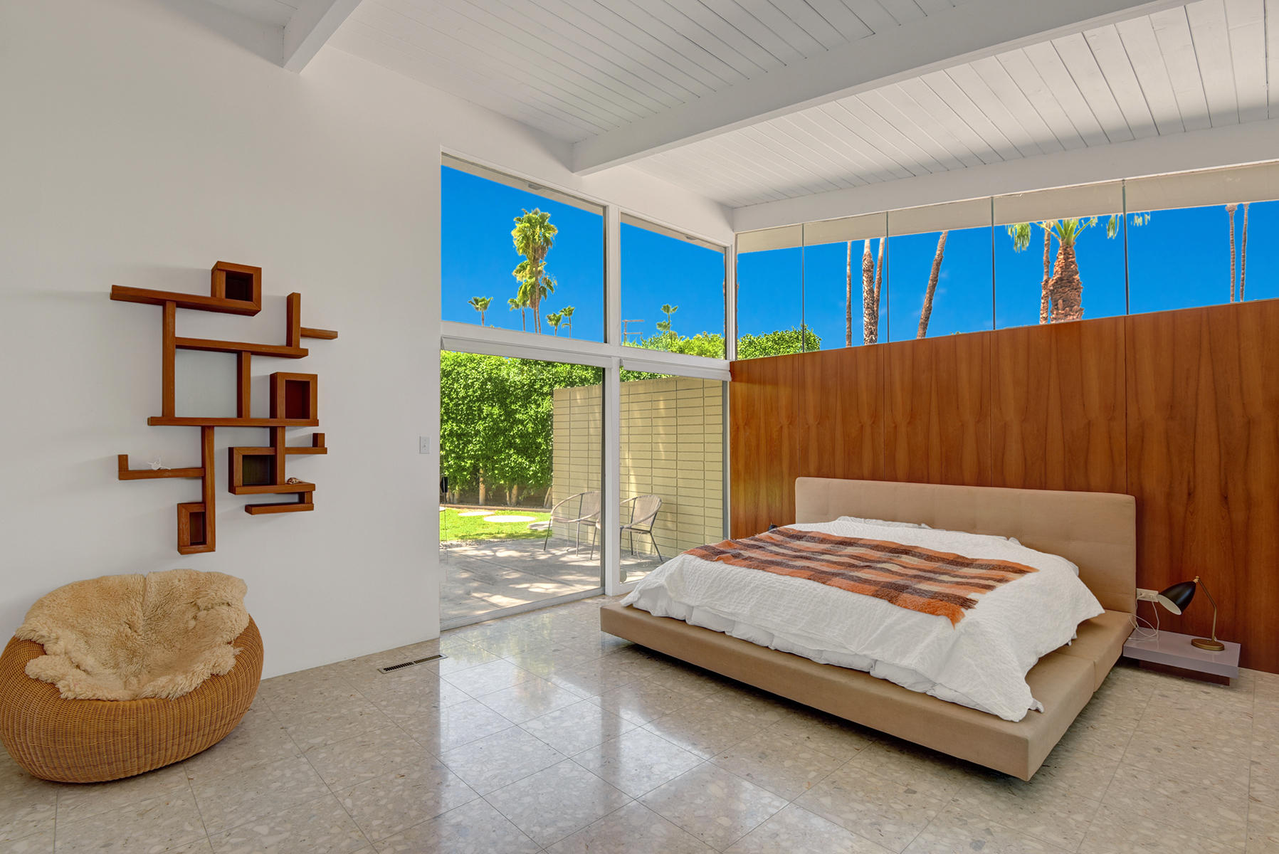 1865 Apache Circle Palm Springs, CA 92264 - Photo 12 of 42 a bedroom with a bed and a painting on the wall