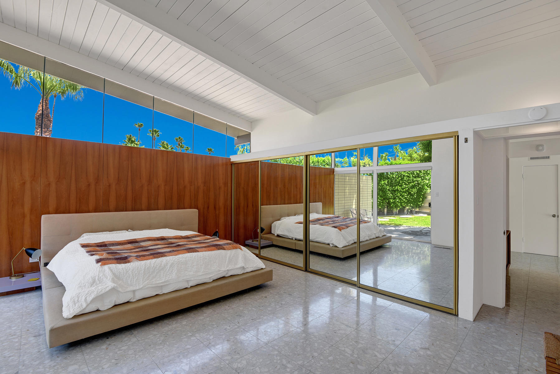 1865 Apache Circle Palm Springs, CA 92264 - Photo 14 of 42 a bedroom with a bed and large window