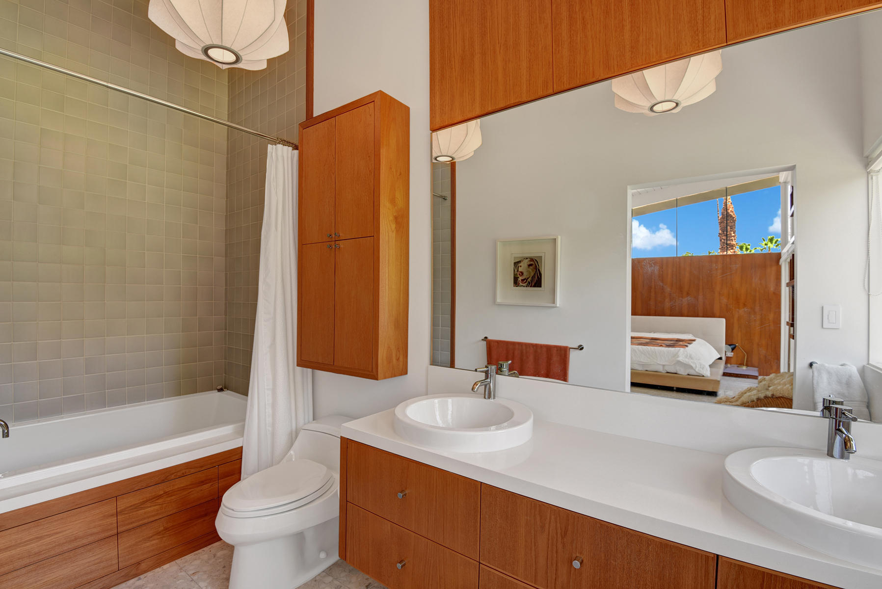 1865 Apache Circle Palm Springs, CA 92264 - Photo 15 of 42 a bathroom with a sink and a mirror