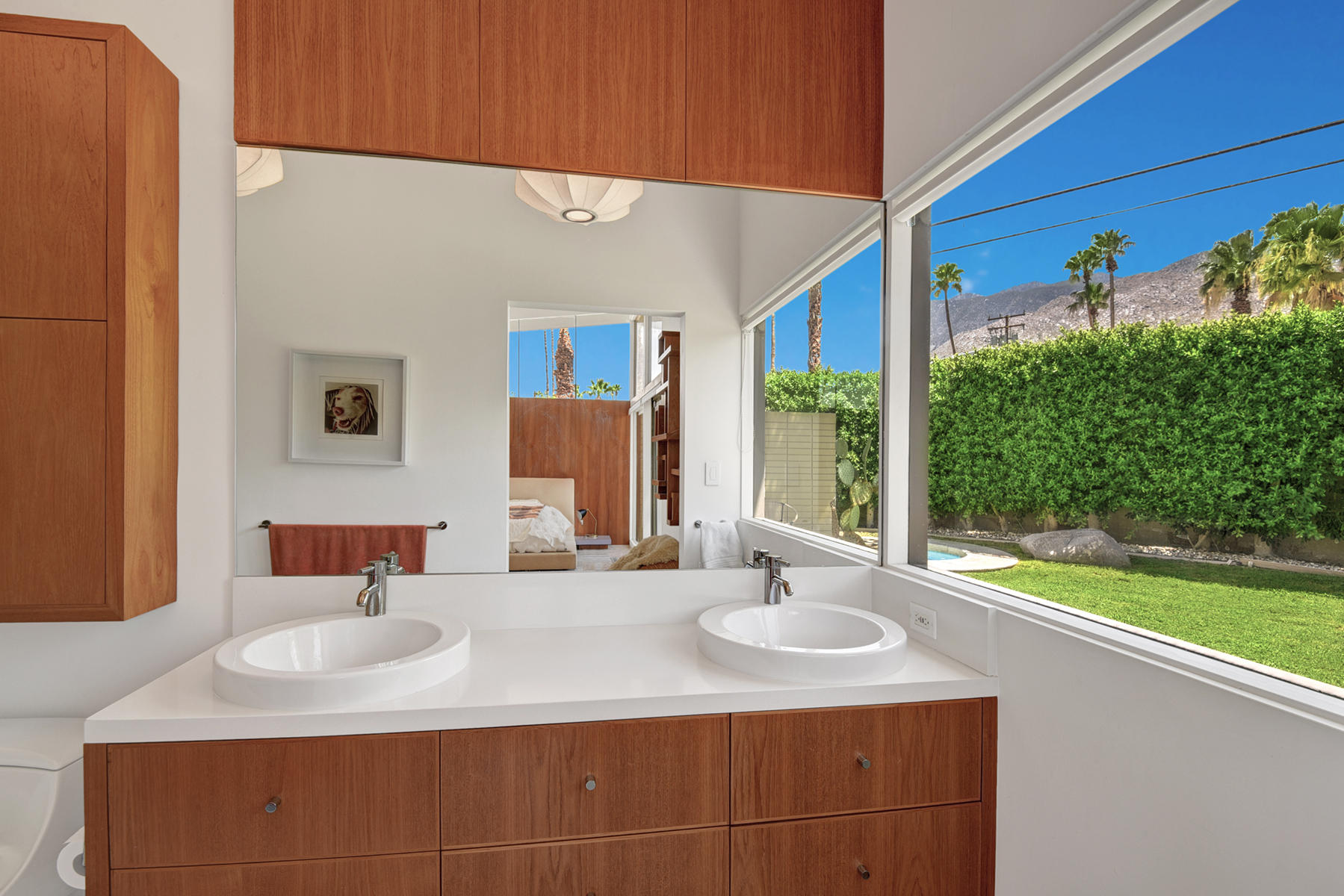 1865 Apache Circle Palm Springs, CA 92264 - Photo 16 of 42 a bathroom with a sink and a mirror