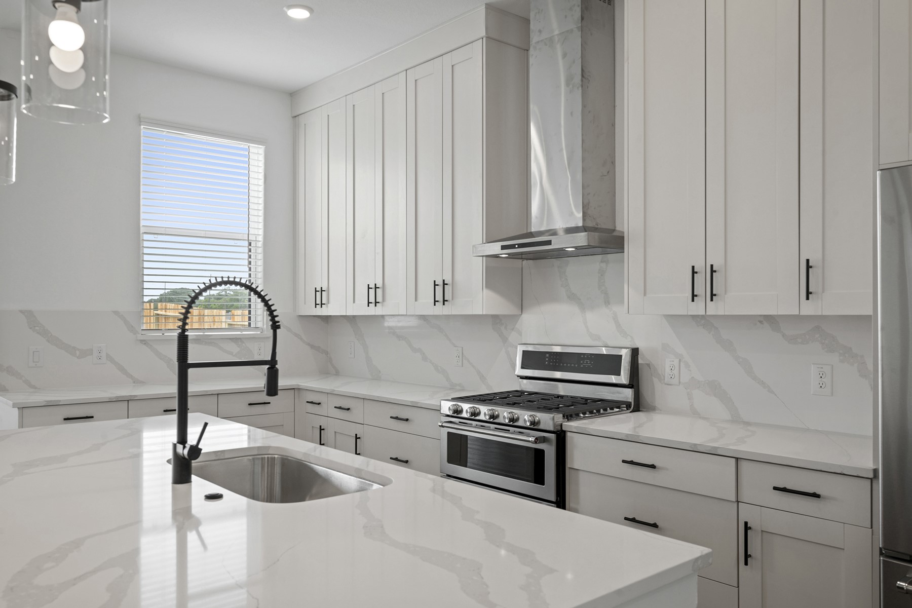 1805 Drover Lane Rosenberg, TX 77471 - Photo 13 of 29 a kitchen with granite countertop a sink and wooden cabinets