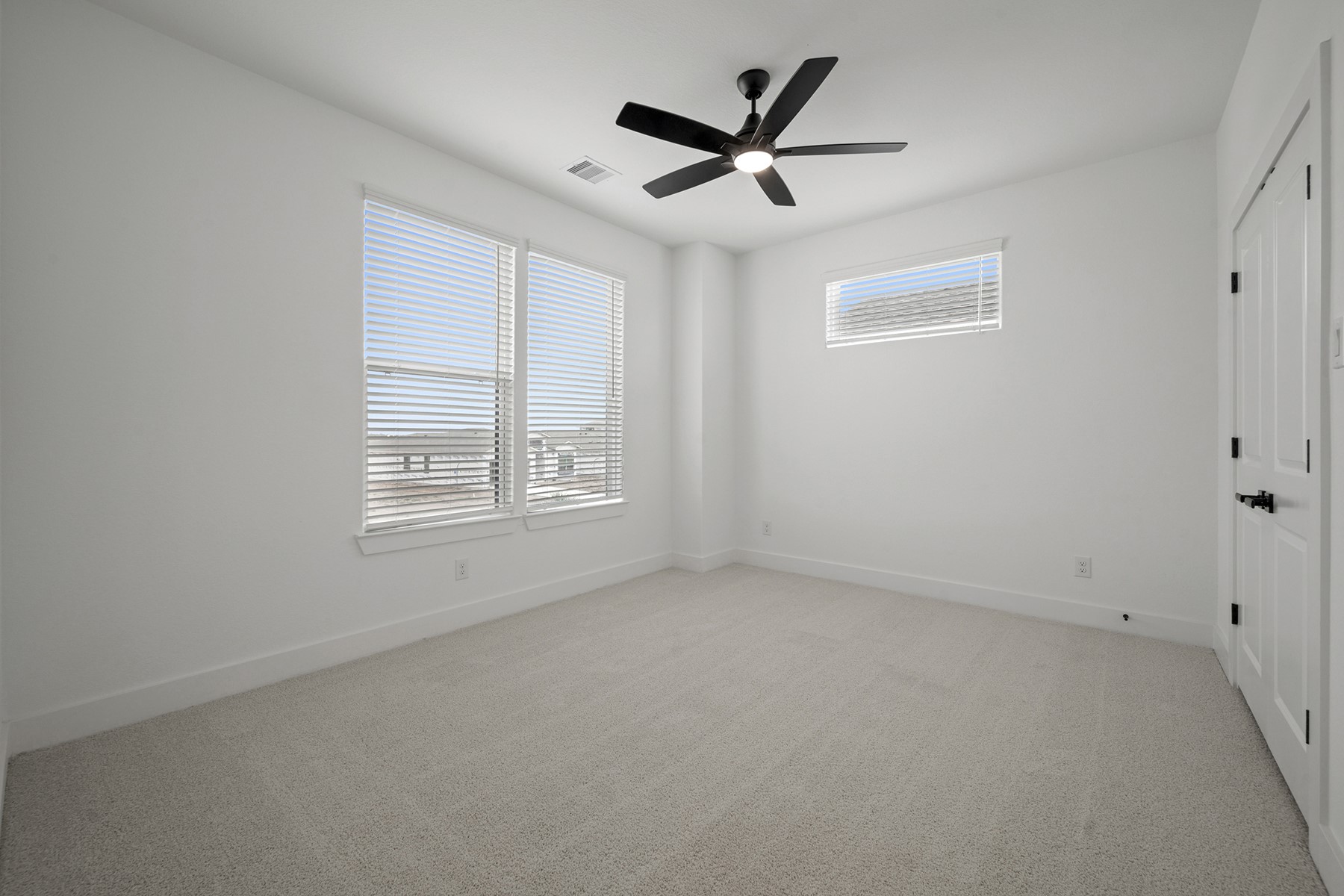 1805 Drover Lane Rosenberg, TX 77471 - Photo 23 of 29 an empty room with window and ceiling fan