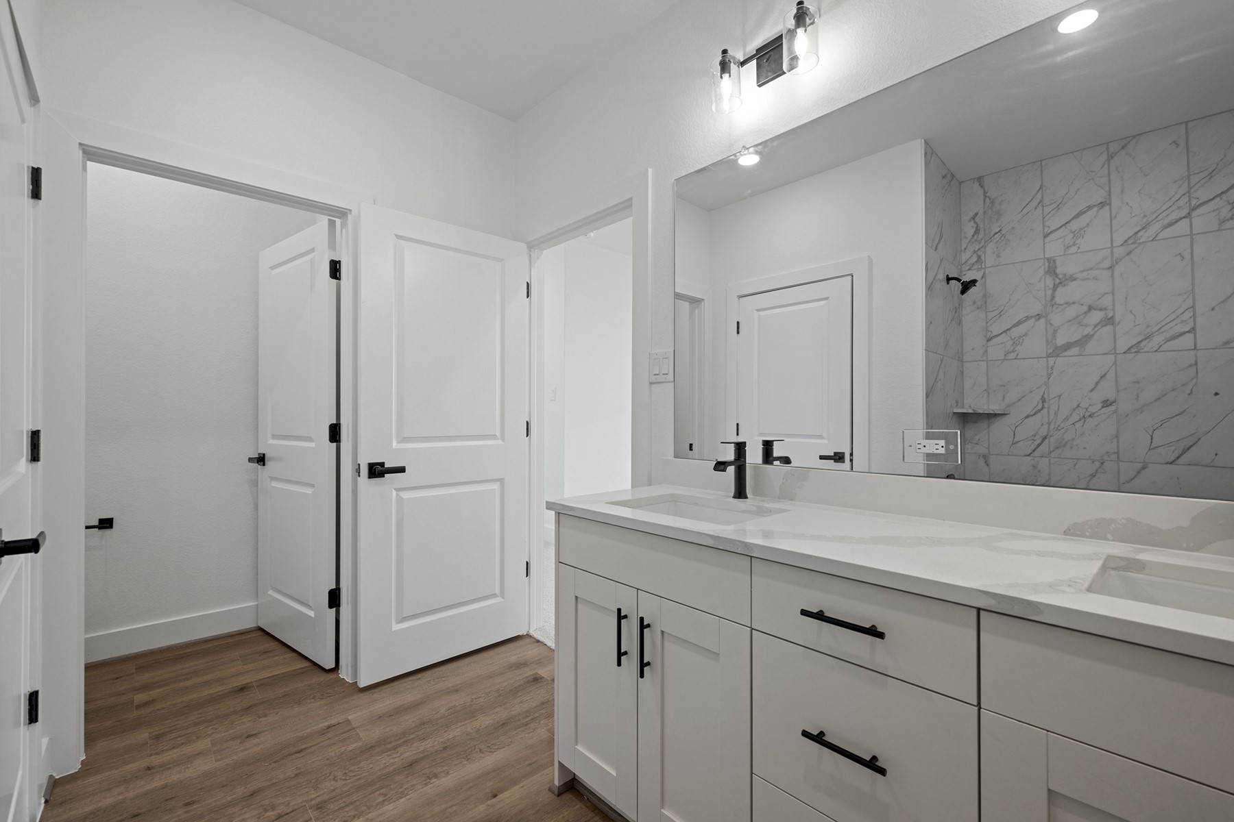1805 Drover Lane Rosenberg, TX 77471 - Photo 26 of 29 a view of bathroom with a sink mirror and shower