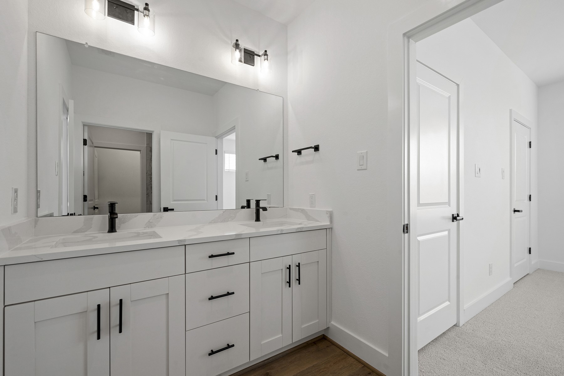 1805 Drover Lane Rosenberg, TX 77471 - Photo 27 of 29 a bathroom with a double vanity sink and mirror