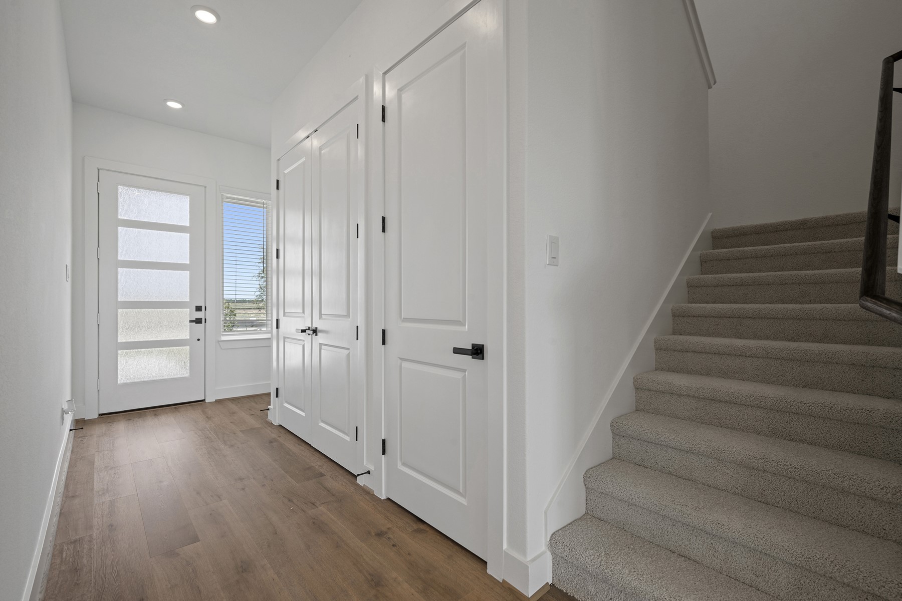 1805 Drover Lane Rosenberg, TX 77471 - Photo 5 of 29 a view of an entryway with wooden floor and staircase