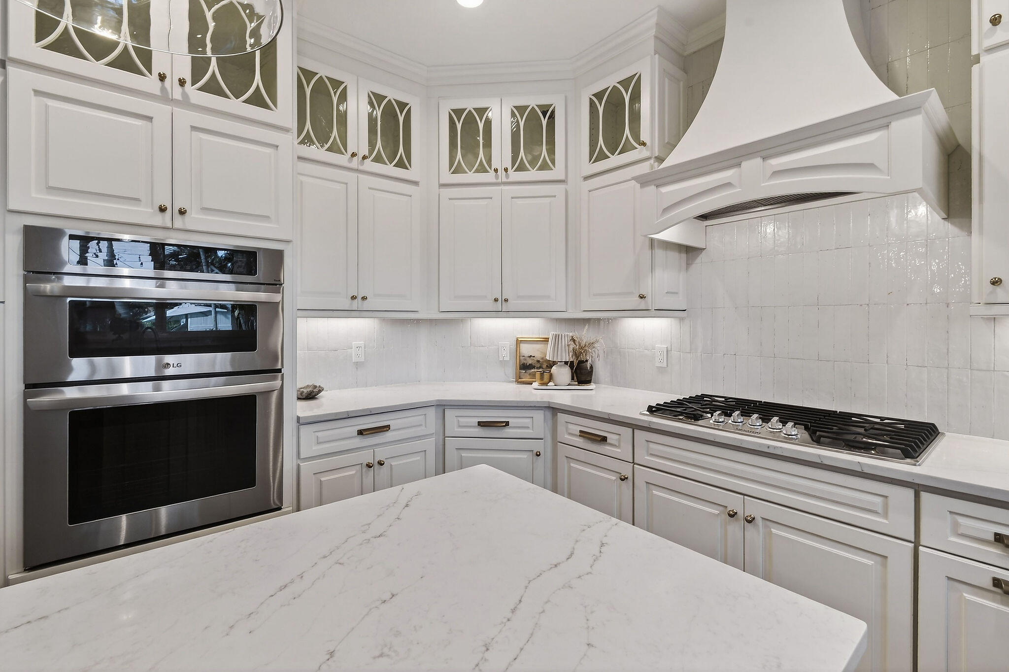 19954 Loxahatchee Pointe Drive Jupiter, FL 33458 - Photo 12 of 60 a kitchen with cabinets stainless steel appliances and a window