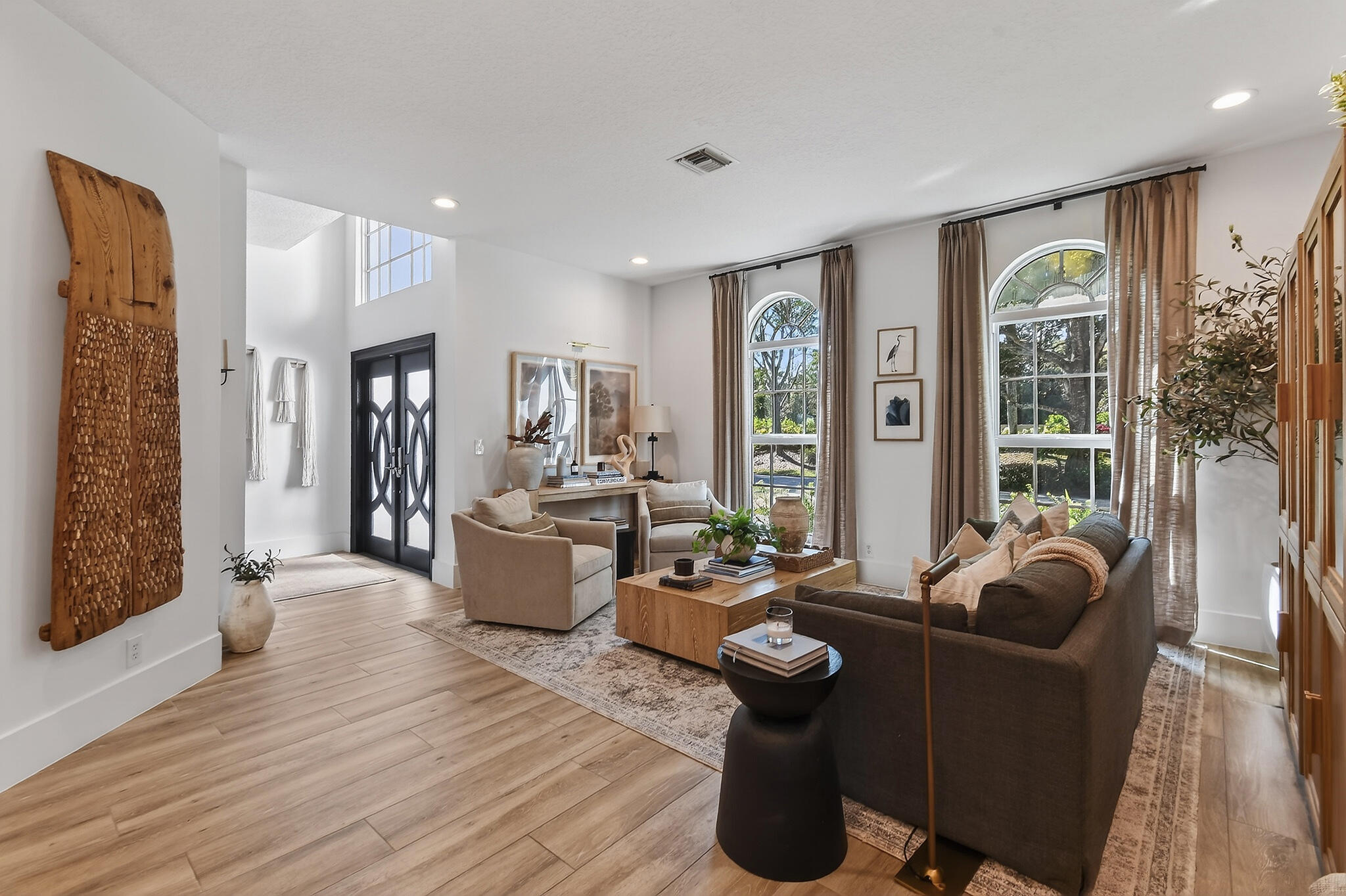 19954 Loxahatchee Pointe Drive Jupiter, FL 33458 - Photo 13 of 60 a living room with furniture and a large window