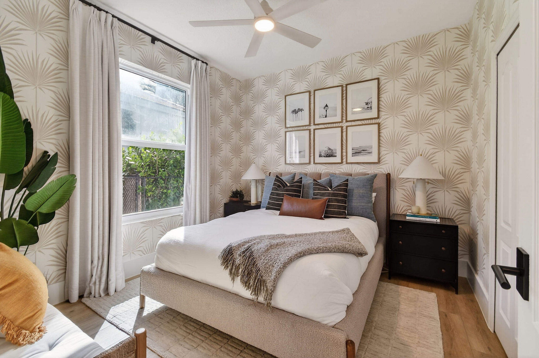 19954 Loxahatchee Pointe Drive Jupiter, FL 33458 - Photo 16 of 60 a bedroom with a bed painting on wall and a large window