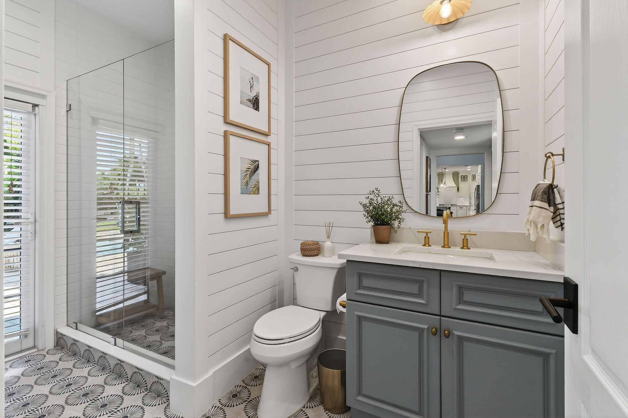 19954 Loxahatchee Pointe Drive Jupiter, FL 33458 - Photo 18 of 60 a bathroom with a toilet a sink and mirror