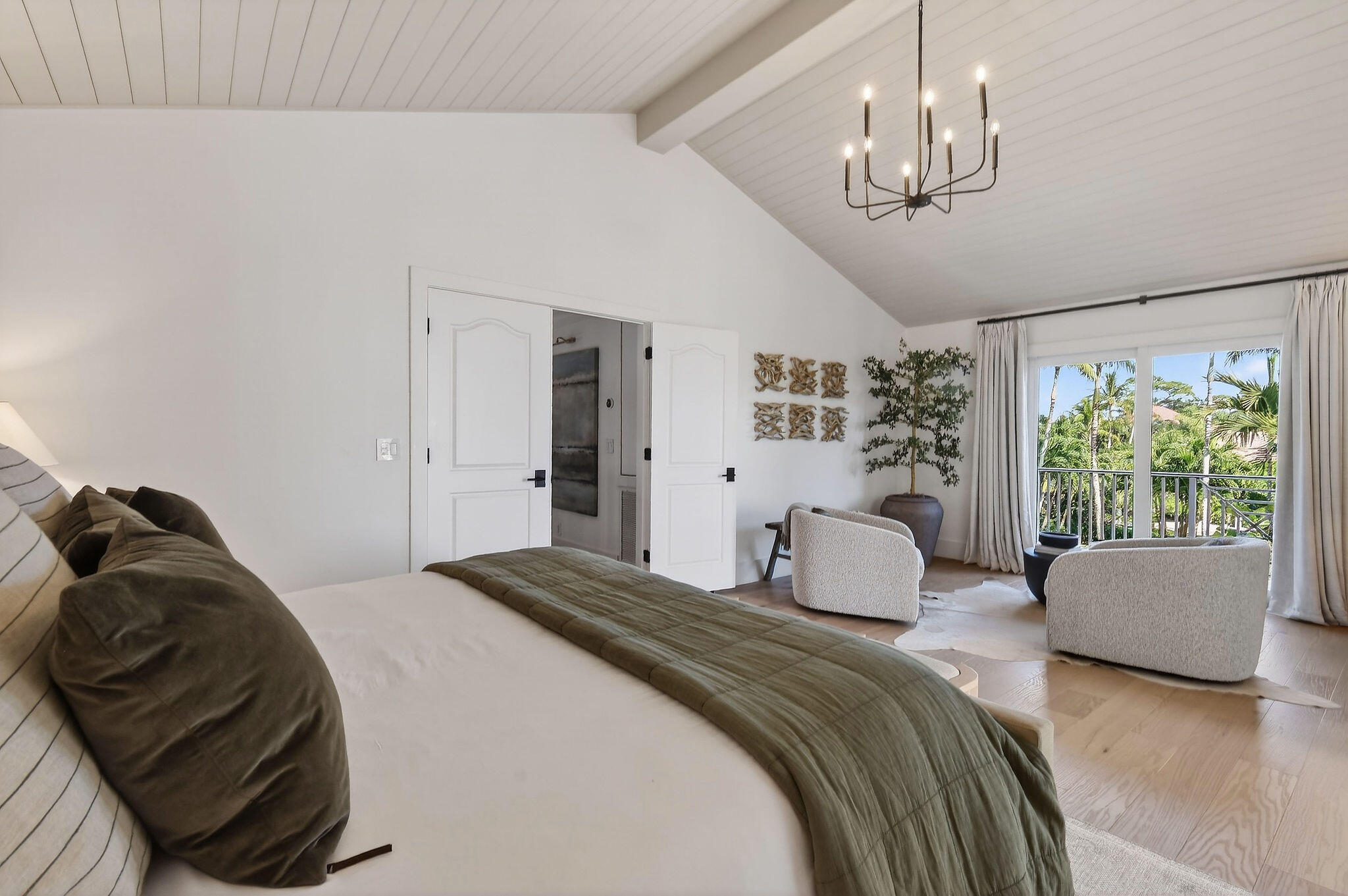 19954 Loxahatchee Pointe Drive Jupiter, FL 33458 - Photo 23 of 60 a bedroom with a bed couches chair and a large window