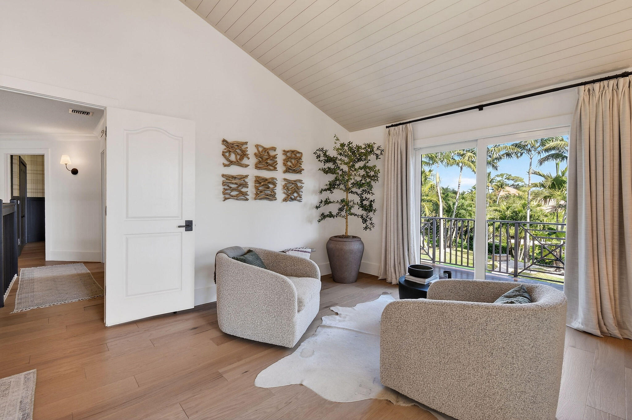 19954 Loxahatchee Pointe Drive Jupiter, FL 33458 - Photo 25 of 60 a living room with furniture and a large window