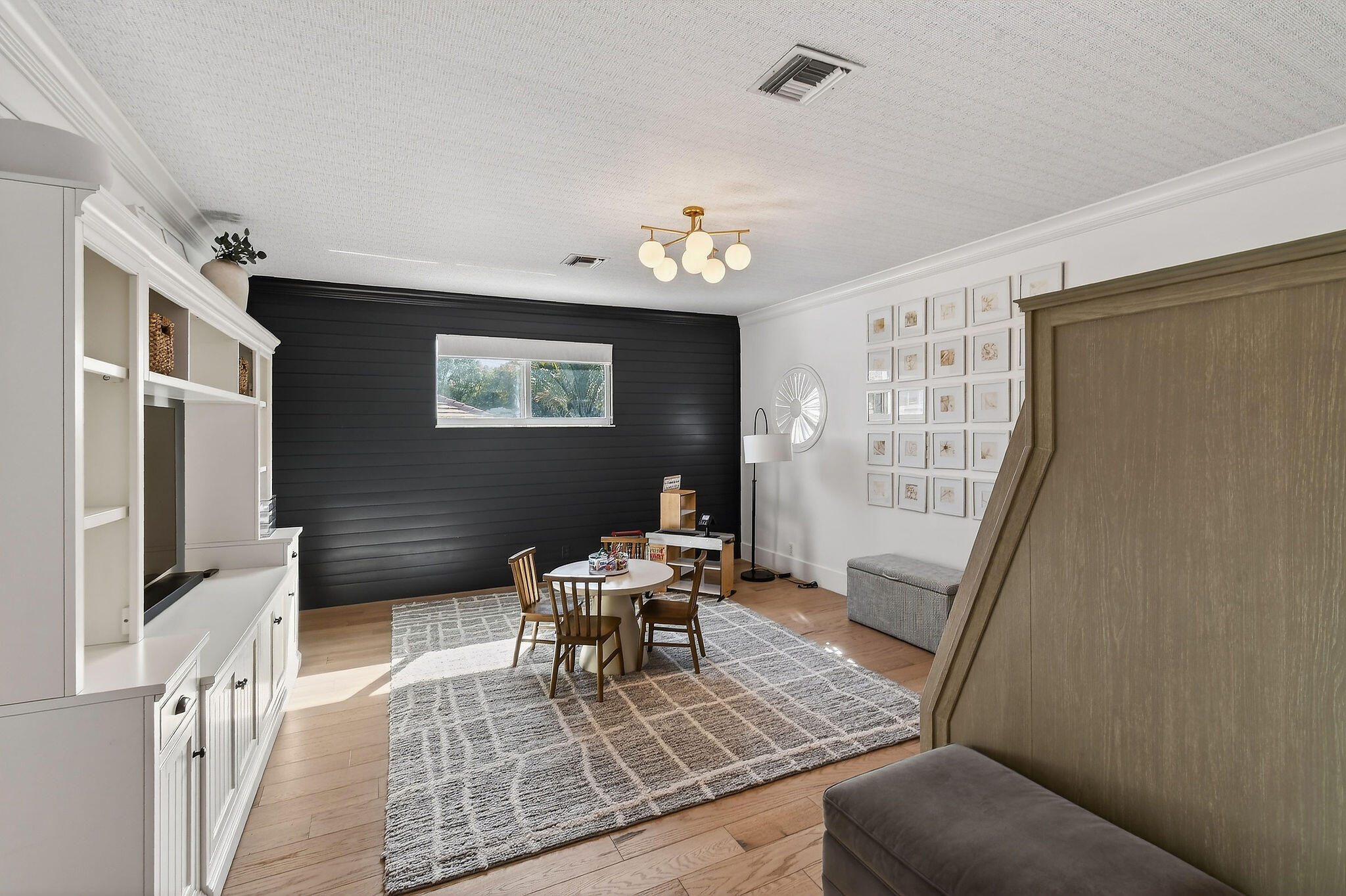 19954 Loxahatchee Pointe Drive Jupiter, FL 33458 - Photo 37 of 60 a living room with furniture and a flat screen tv