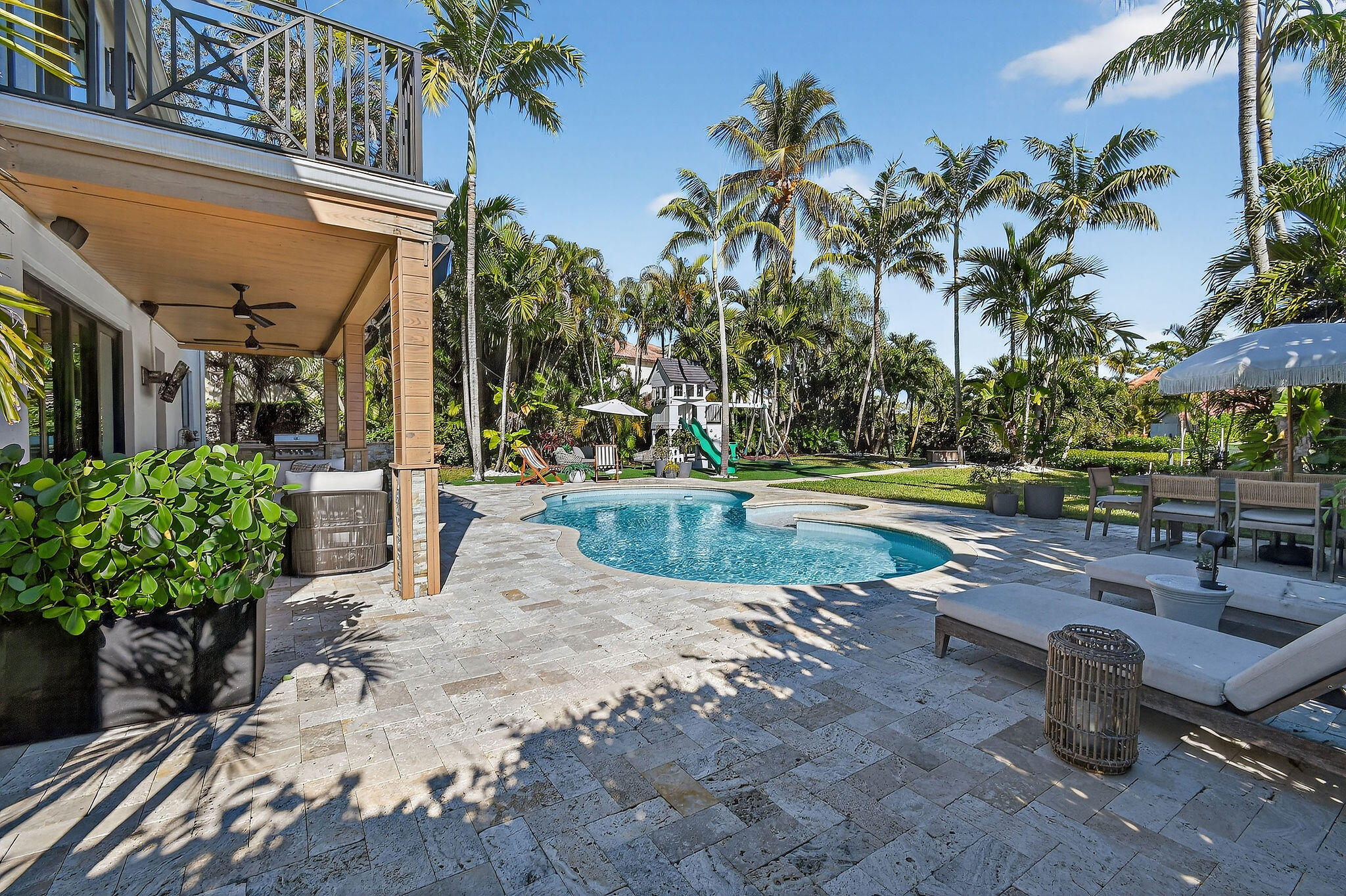19954 Loxahatchee Pointe Drive Jupiter, FL 33458 - Photo 40 of 60 a view of a swimming pool with a patio