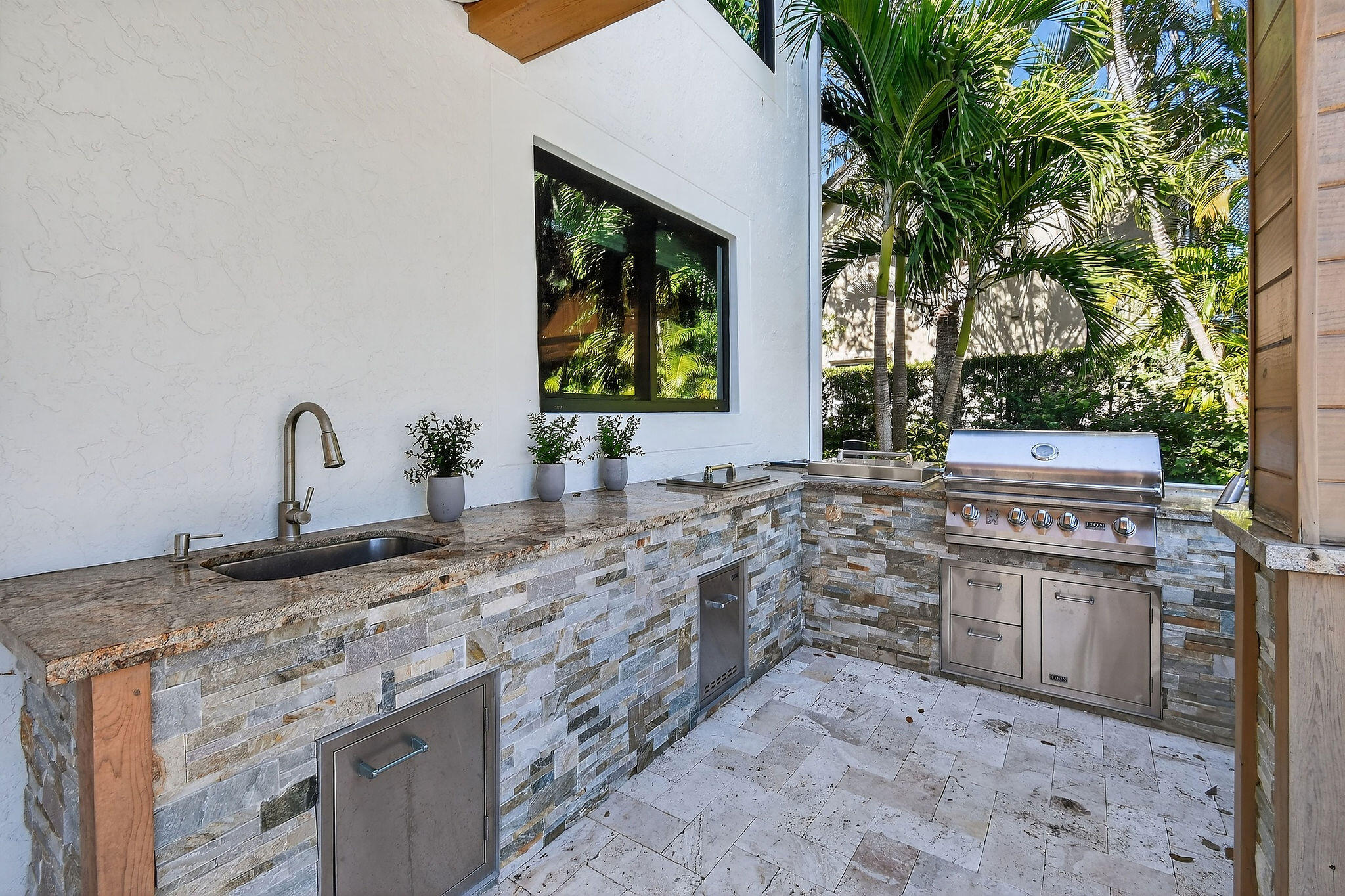 19954 Loxahatchee Pointe Drive Jupiter, FL 33458 - Photo 42 of 60 a kitchen with sink stove and cabinets