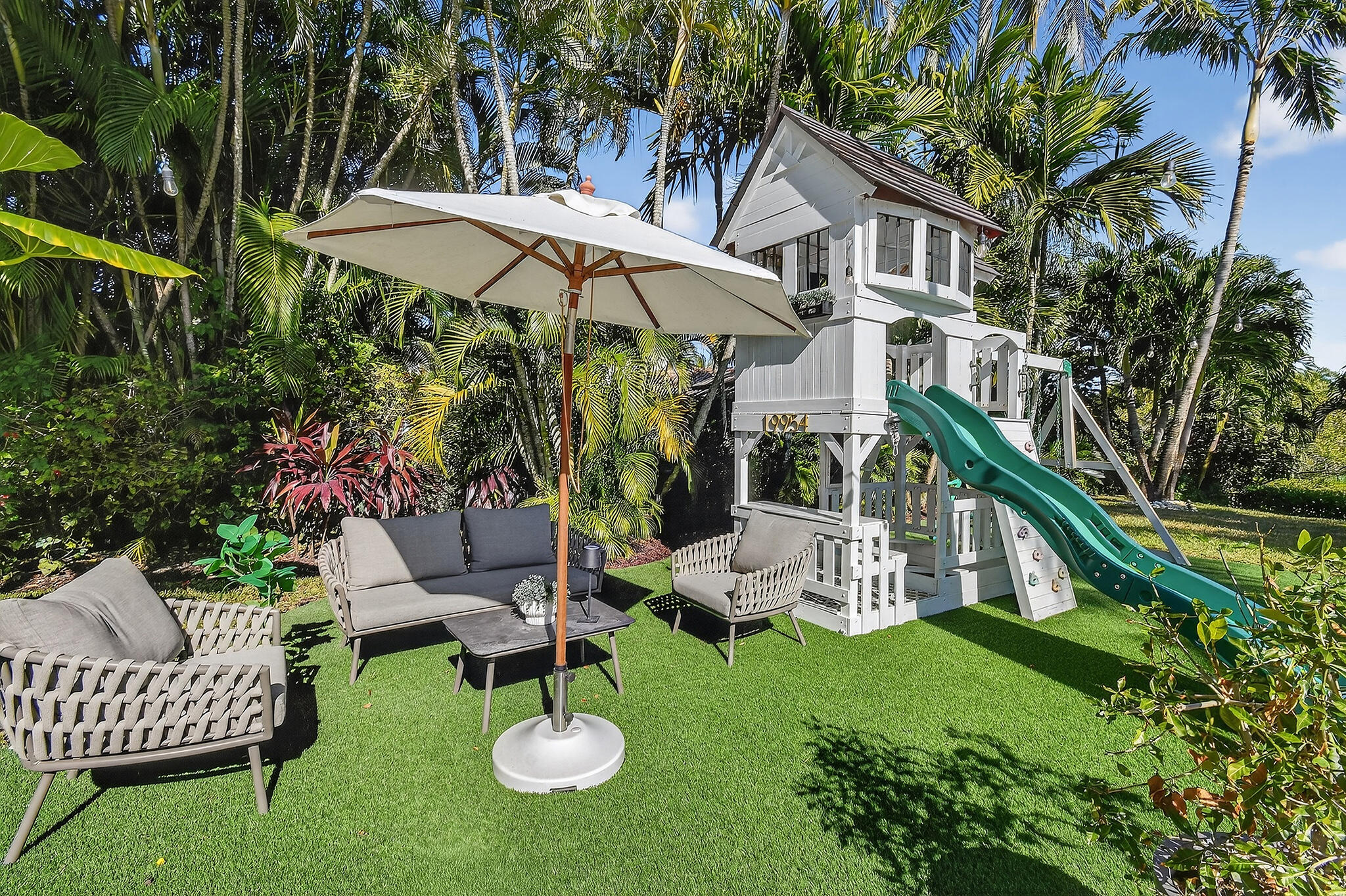 19954 Loxahatchee Pointe Drive Jupiter, FL 33458 - Photo 44 of 60 a view of a house with backyard porch and sitting area