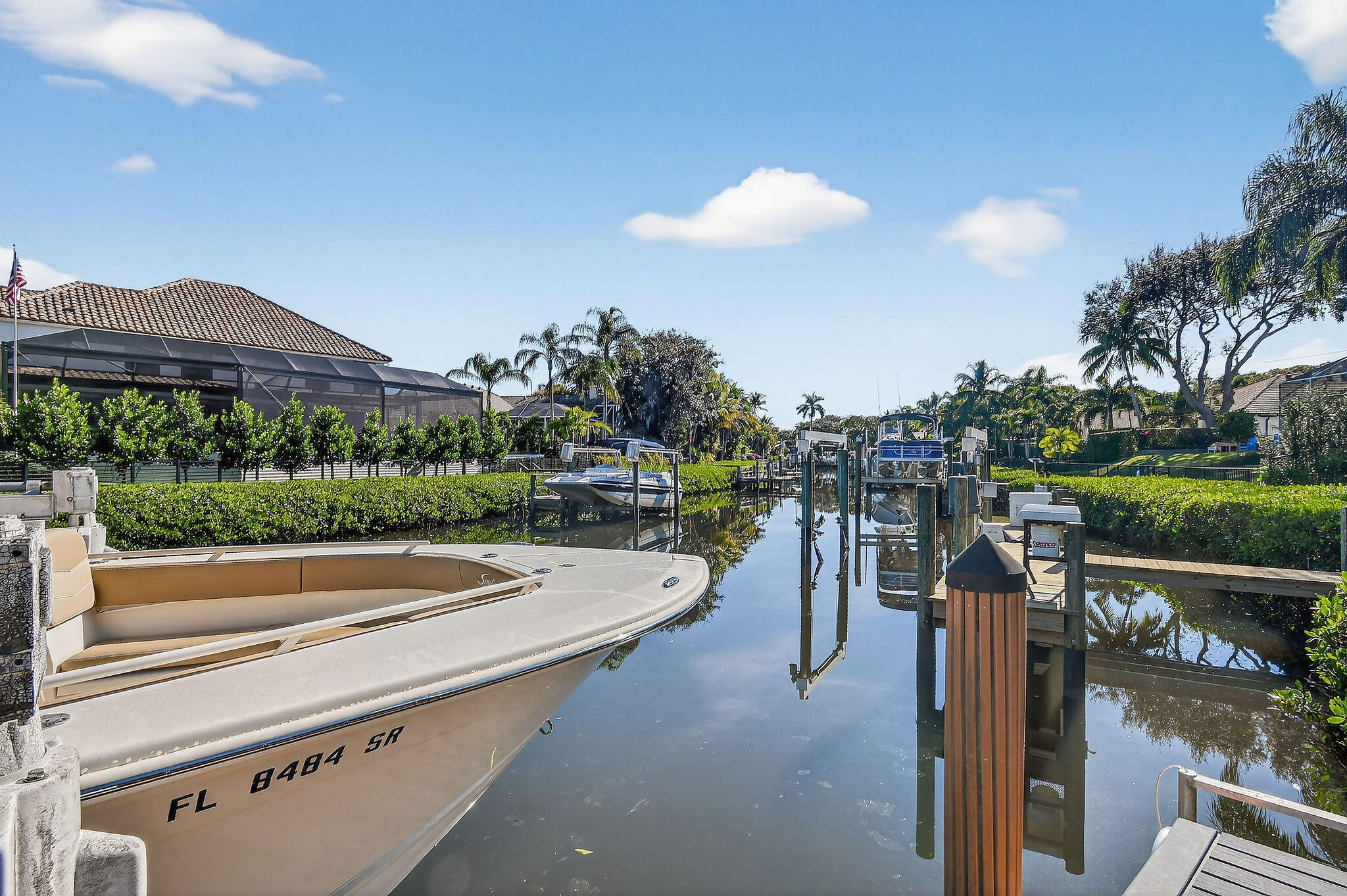 19954 Loxahatchee Pointe Drive Jupiter, FL 33458 - Photo 51 of 60 a view of a terrace with a garden and deck