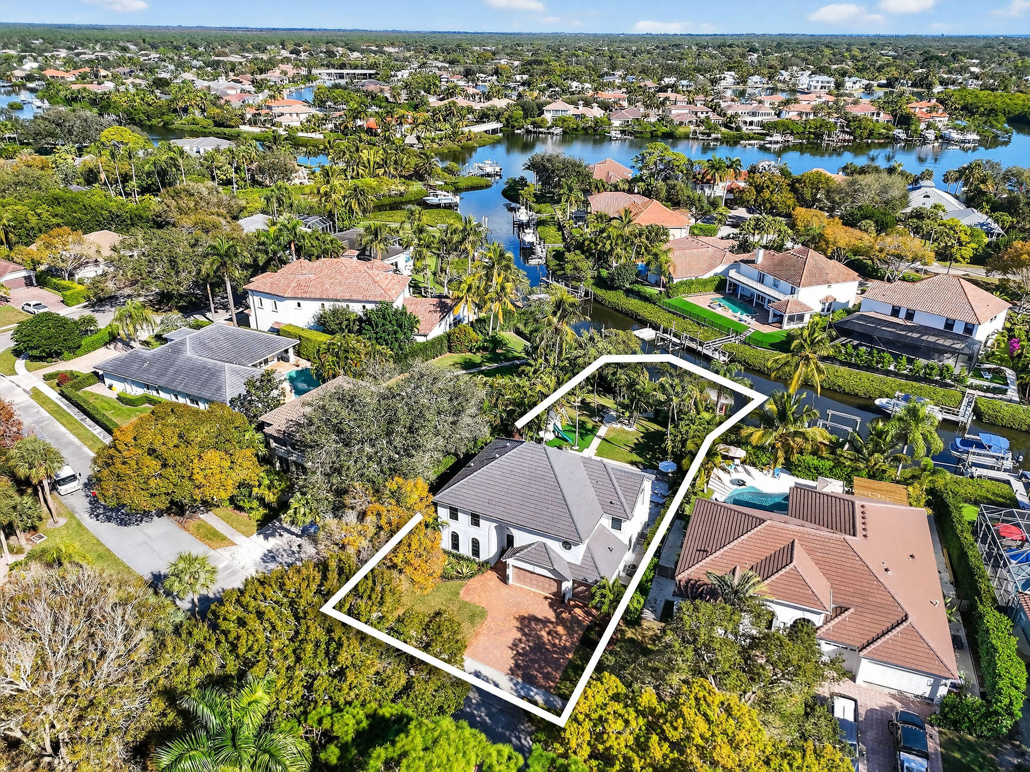 19954 Loxahatchee Pointe Drive Jupiter, FL 33458 - Photo 55 of 60 an aerial view of residential houses with outdoor space