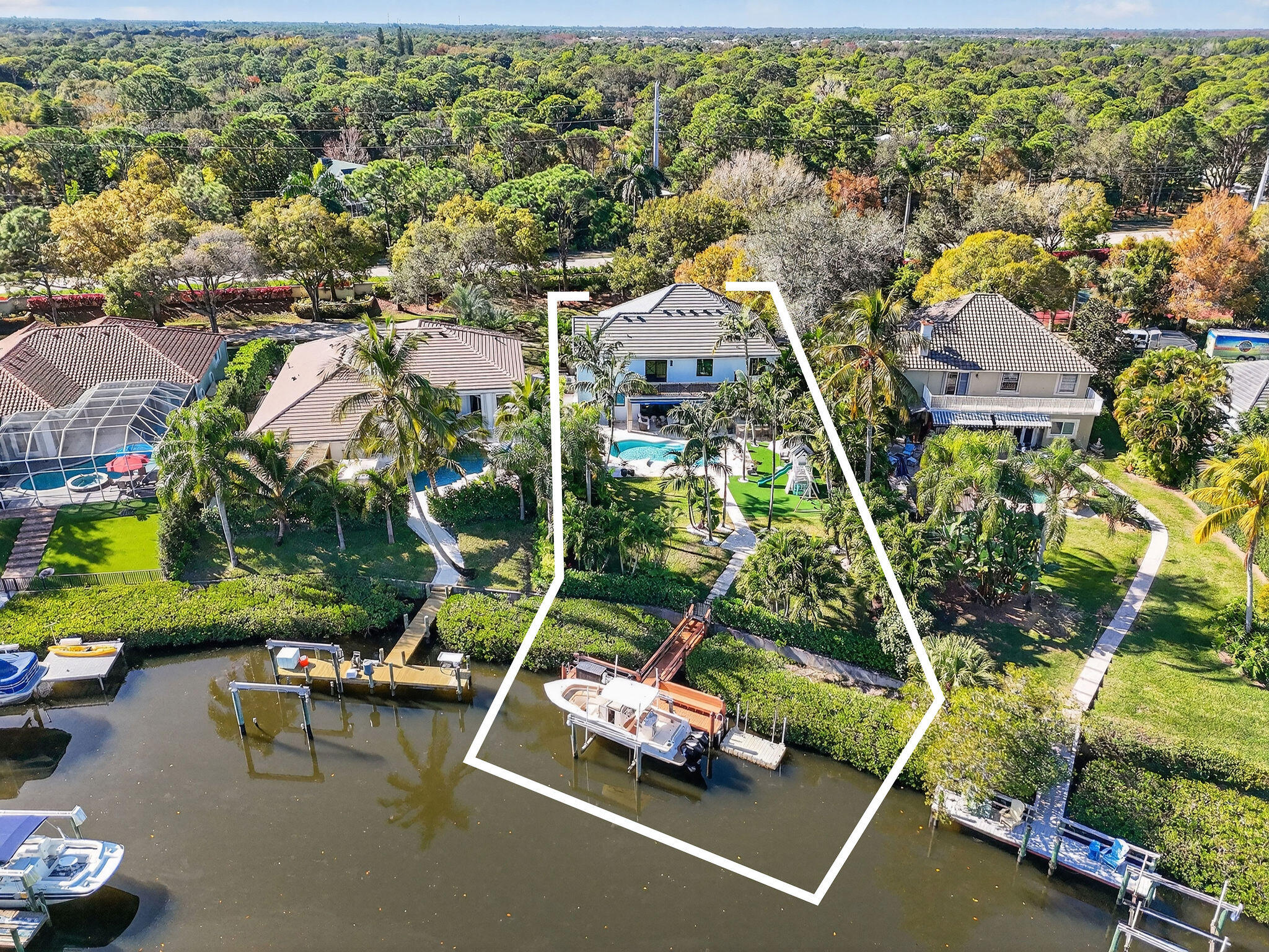 19954 Loxahatchee Pointe Drive Jupiter, FL 33458 - Photo 58 of 60 an aerial view of a houses with a yard