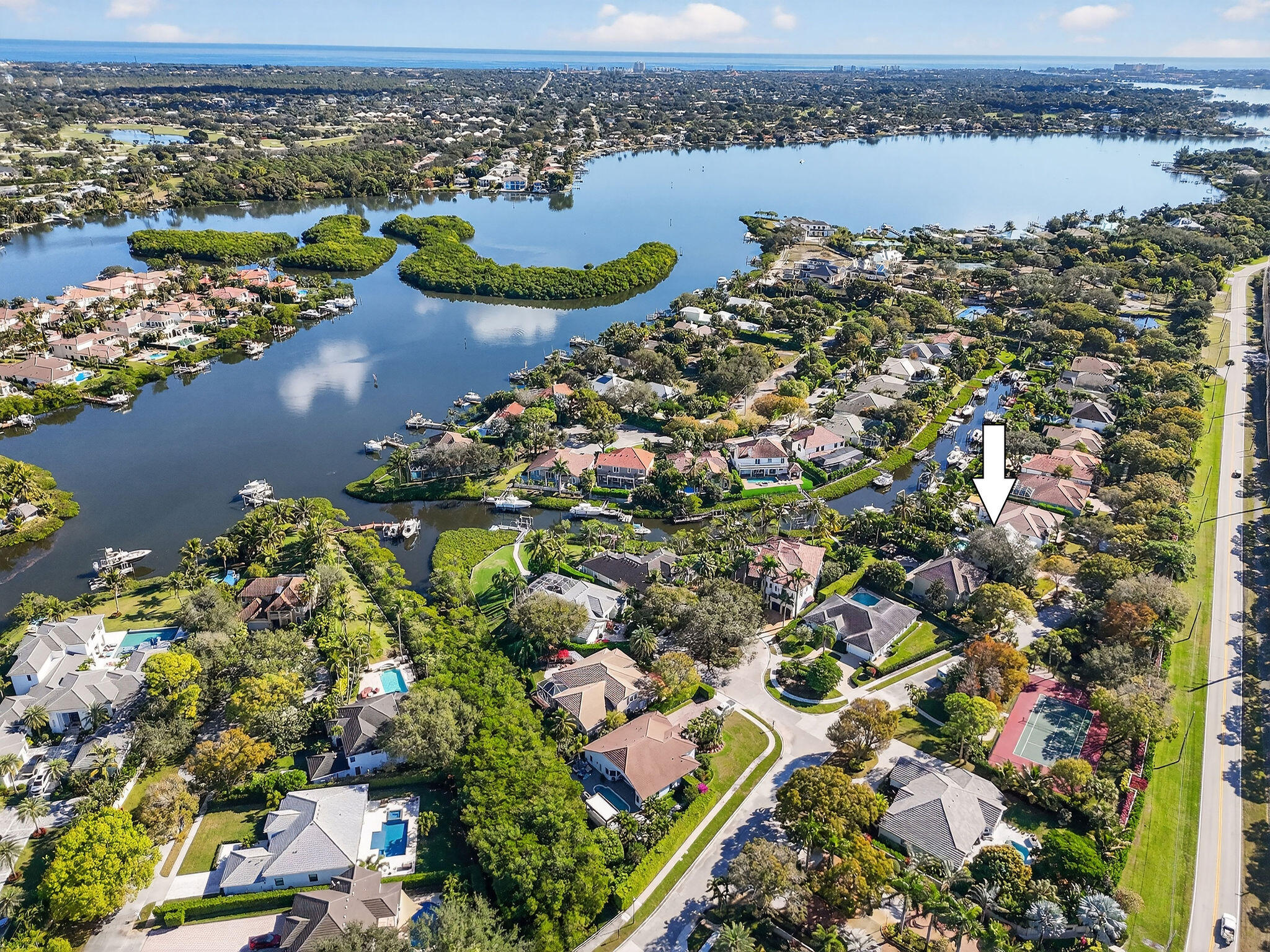 19954 Loxahatchee Pointe Drive Jupiter, FL 33458 - Photo 59 of 60 an aerial view of lake and residential houses with outdoor space