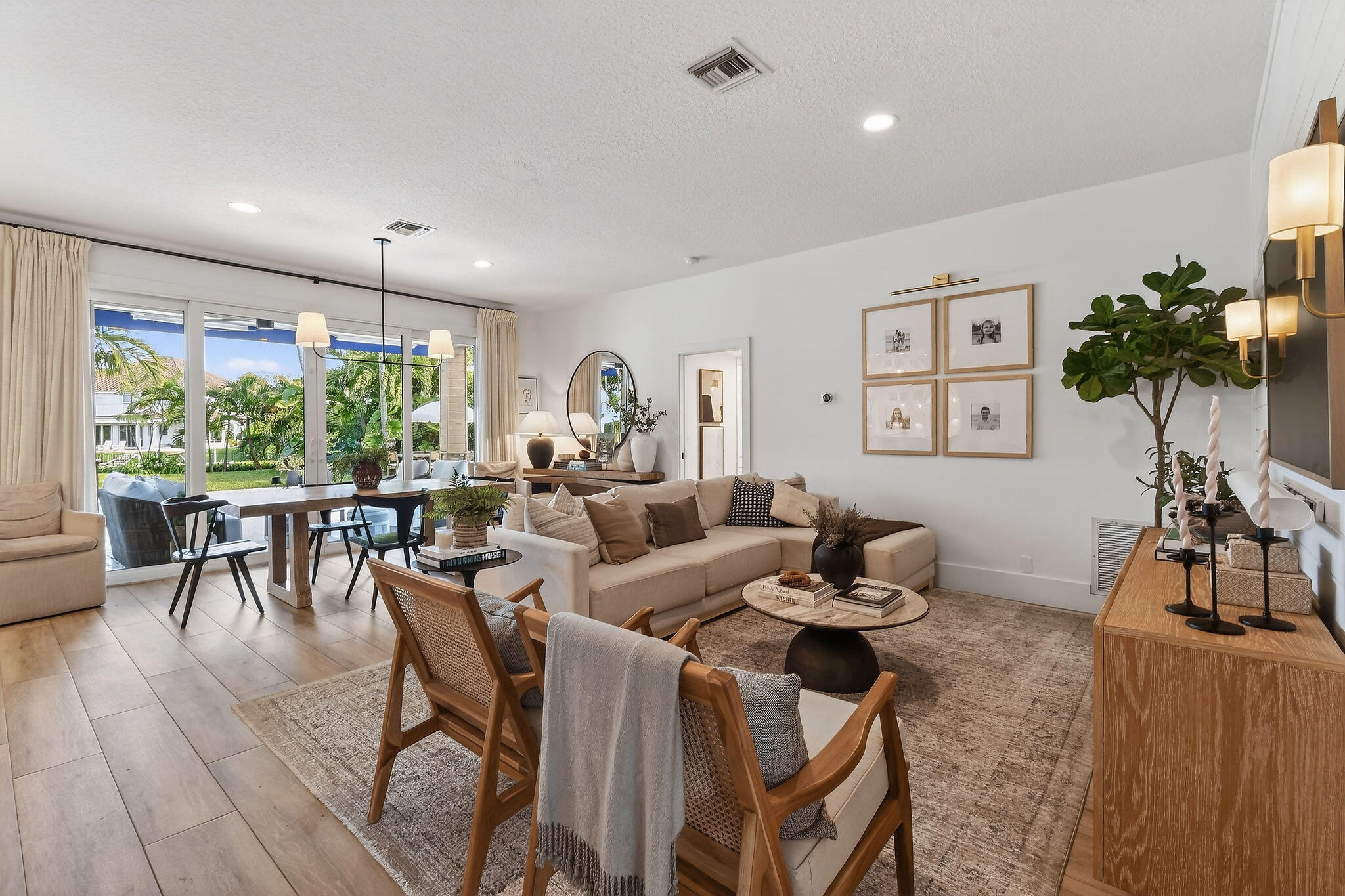 19954 Loxahatchee Pointe Drive Jupiter, FL 33458 - Photo 6 of 60 a living room with furniture and a large window
