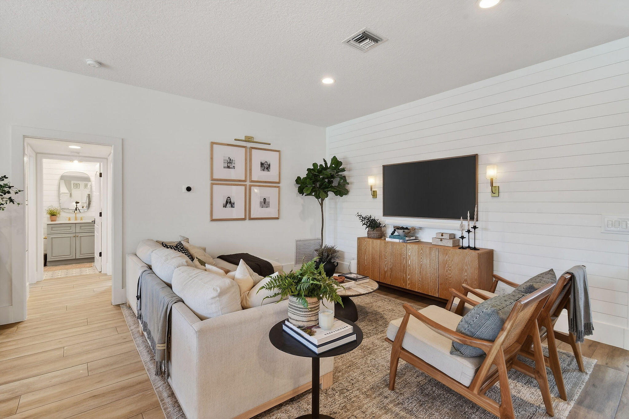19954 Loxahatchee Pointe Drive Jupiter, FL 33458 - Photo 7 of 60 a living room with furniture and a flat screen tv