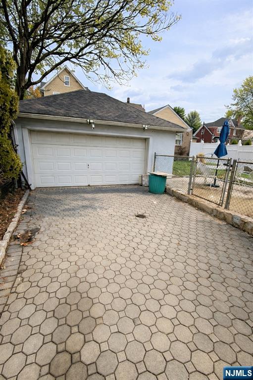 54 College Place Ridgefield Park, NJ 07660 - Photo 16 of 18 a house that has a tree in front of it