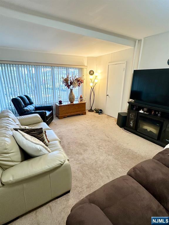 54 College Place Ridgefield Park, NJ 07660 - Photo 2 of 18 a living room with furniture and a flat screen tv