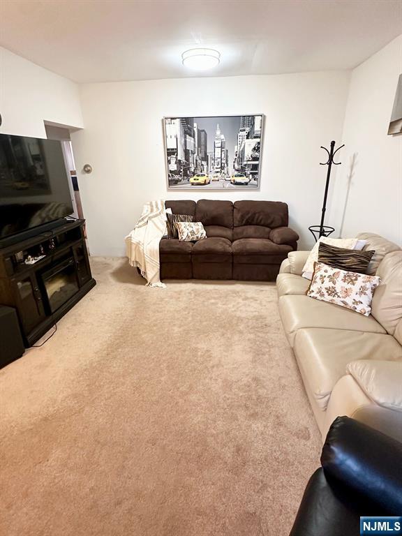 54 College Place Ridgefield Park, NJ 07660 - Photo 5 of 18 a living room with furniture and a flat screen tv