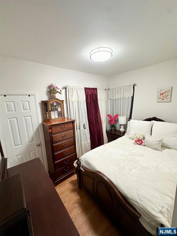 54 College Place Ridgefield Park, NJ 07660 - Photo 7 of 18 a bedroom with a bed and a closet