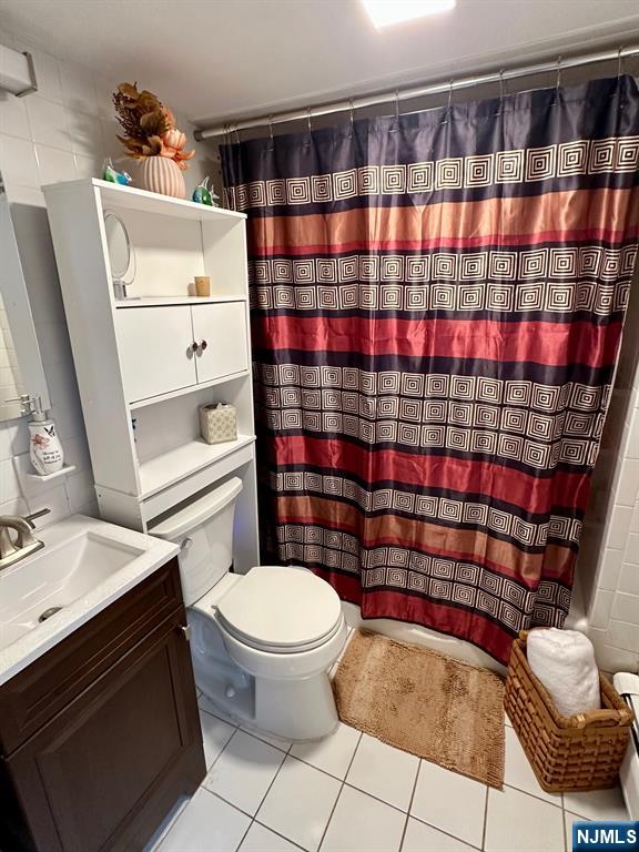 54 College Place Ridgefield Park, NJ 07660 - Photo 9 of 18 a bathroom with a sink toilet and shower