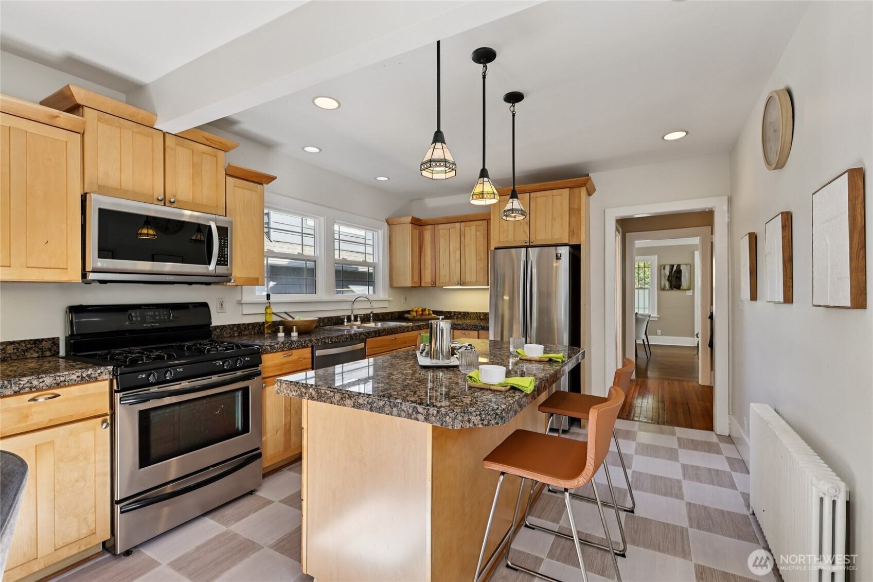 511 23rd Avenue East Seattle, WA 98112 - Photo 14 of 39 a kitchen with granite countertop a stove a sink a kitchen island a stove and a cabinets