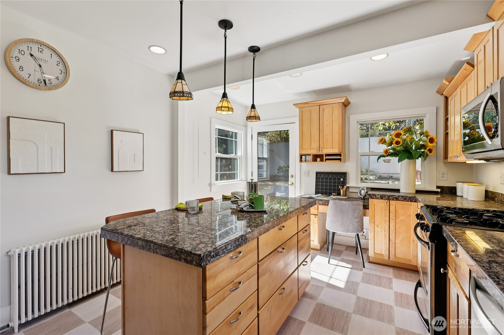 511 23rd Avenue East Seattle, WA 98112 - Photo 15 of 39 a kitchen with stainless steel appliances granite countertop a stove and a sink