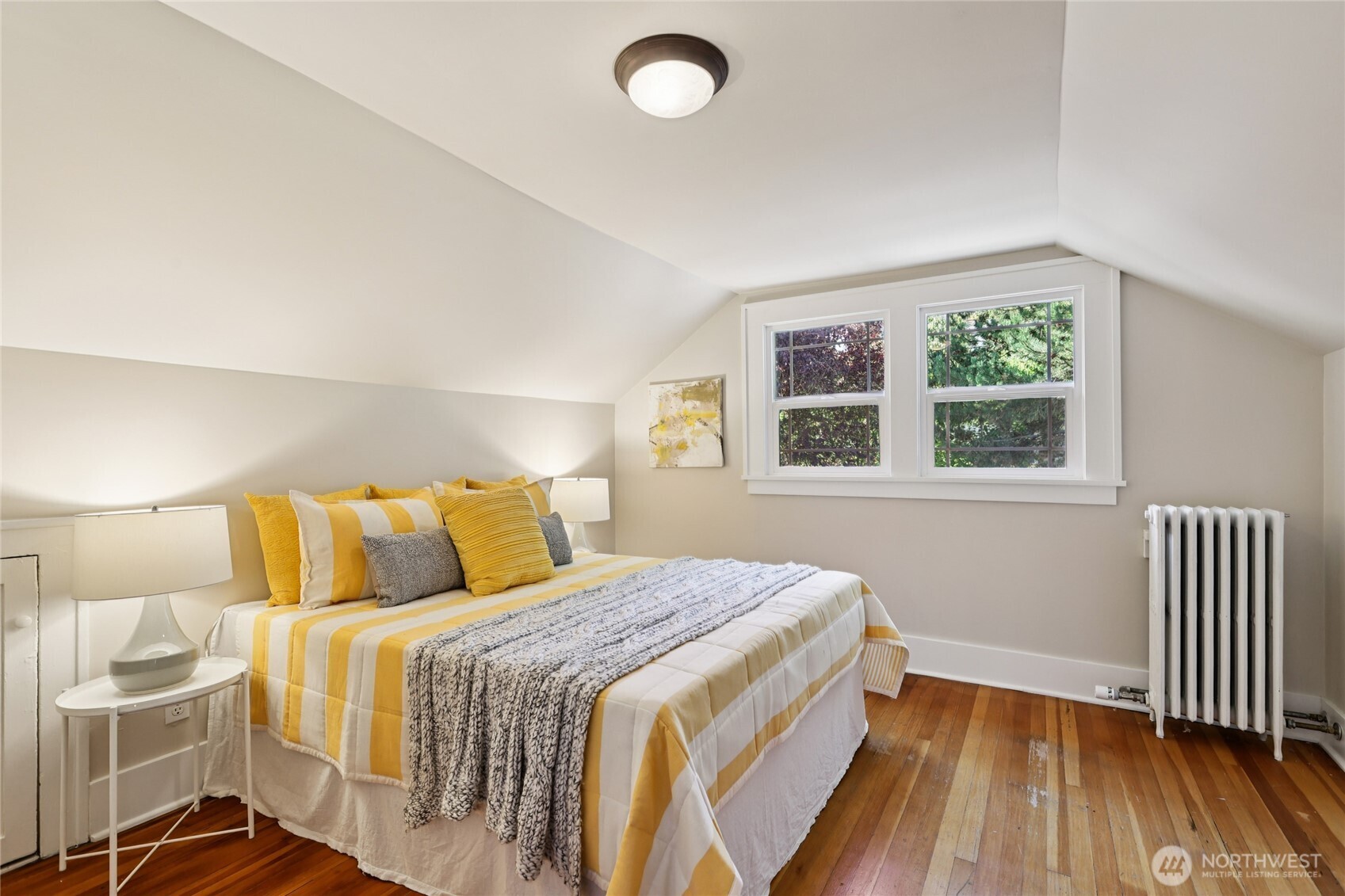 511 23rd Avenue East Seattle, WA 98112 - Photo 21 of 39 a bedroom with a bed and a window