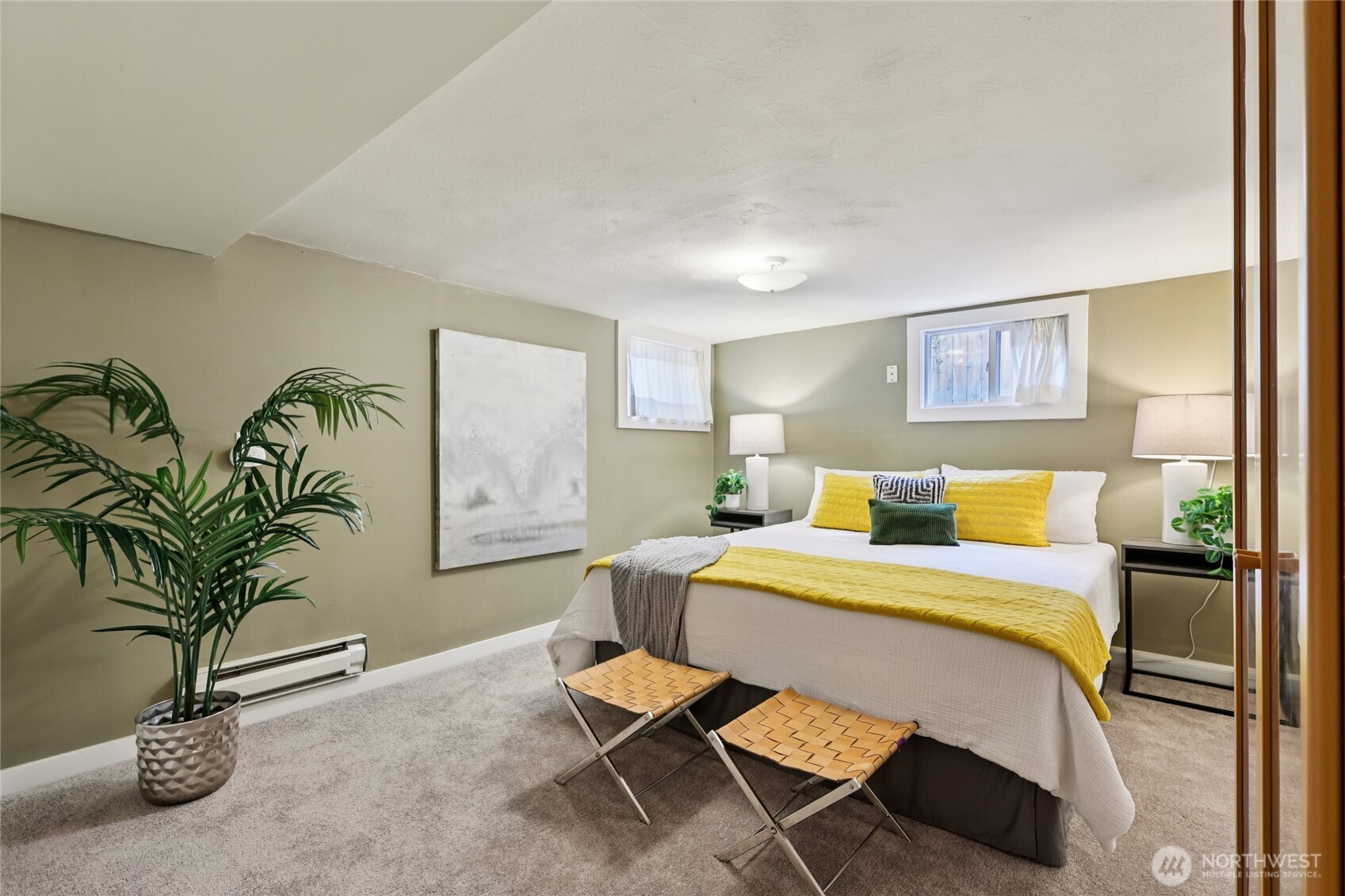 511 23rd Avenue East Seattle, WA 98112 - Photo 24 of 39 a bedroom with a bed and potted plant