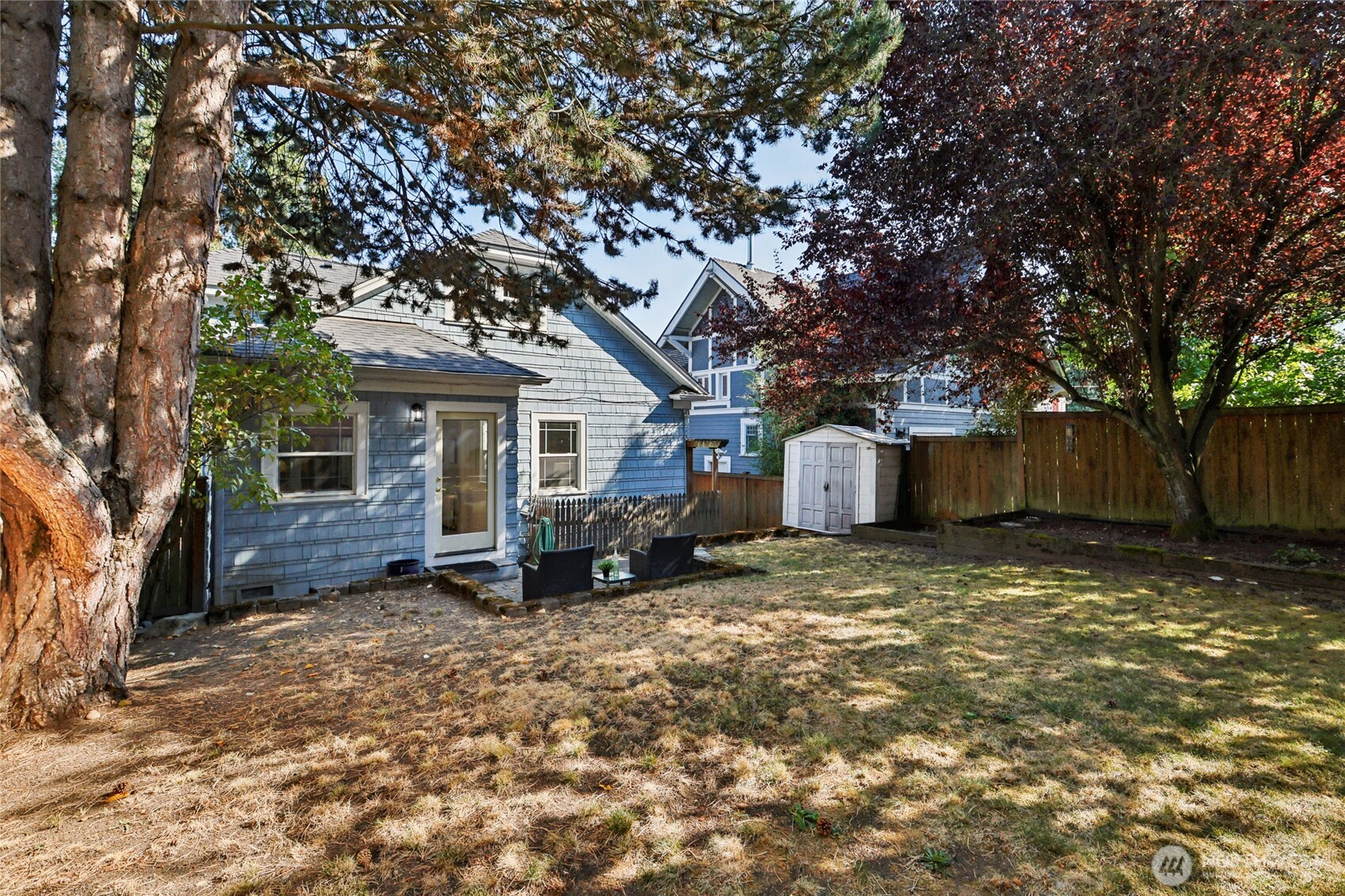 511 23rd Avenue East Seattle, WA 98112 - Photo 29 of 39 a view of a house with a yard covered in the forest